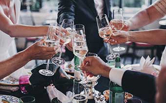 People cheersing at a wedding